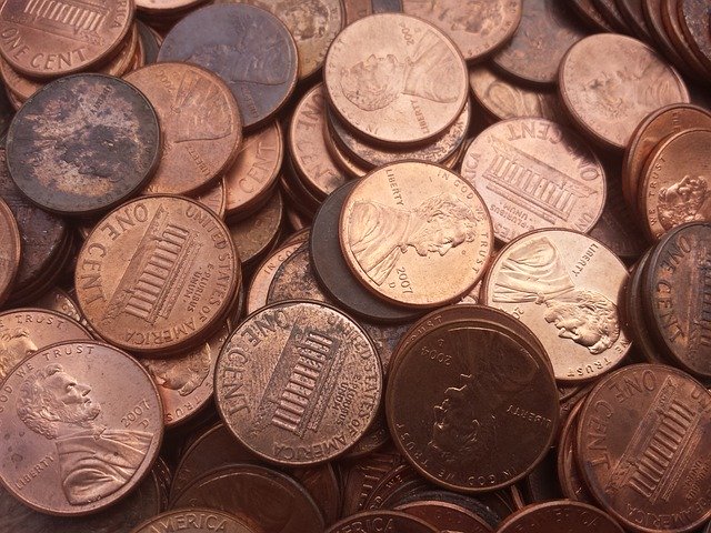 big stash of pennies waiting to be counted, sorted and rolled